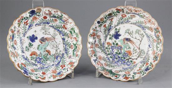 A pair of Chinese famille verte petal moulded saucer dishes, Kangxi period, diameter 16.5cm, slight damage